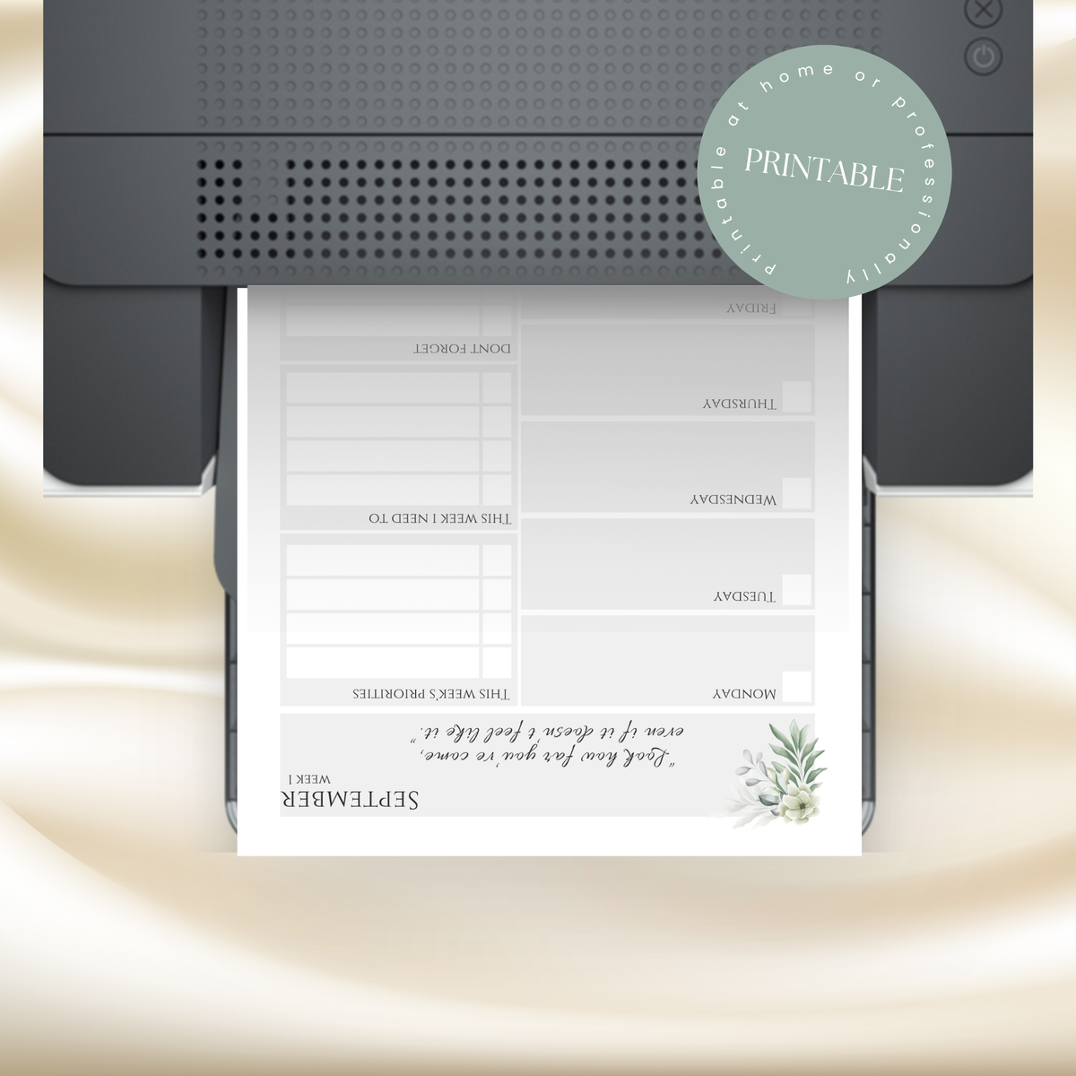 A printable budget planner page shown emerging from a black printer, with a mint green 'PRINTABLE' badge overlay on a soft beige fabric background.
